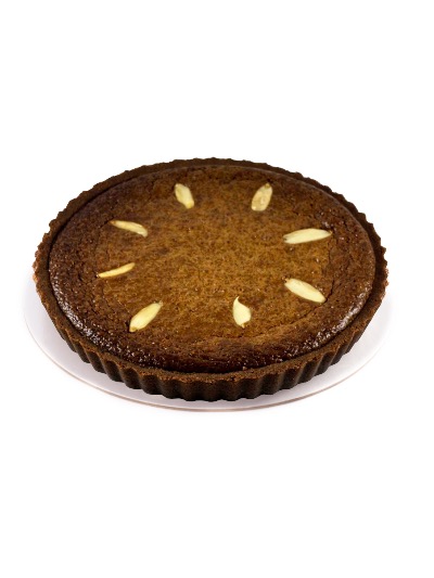 Pili Billionaire tart dusted with cocoa powder